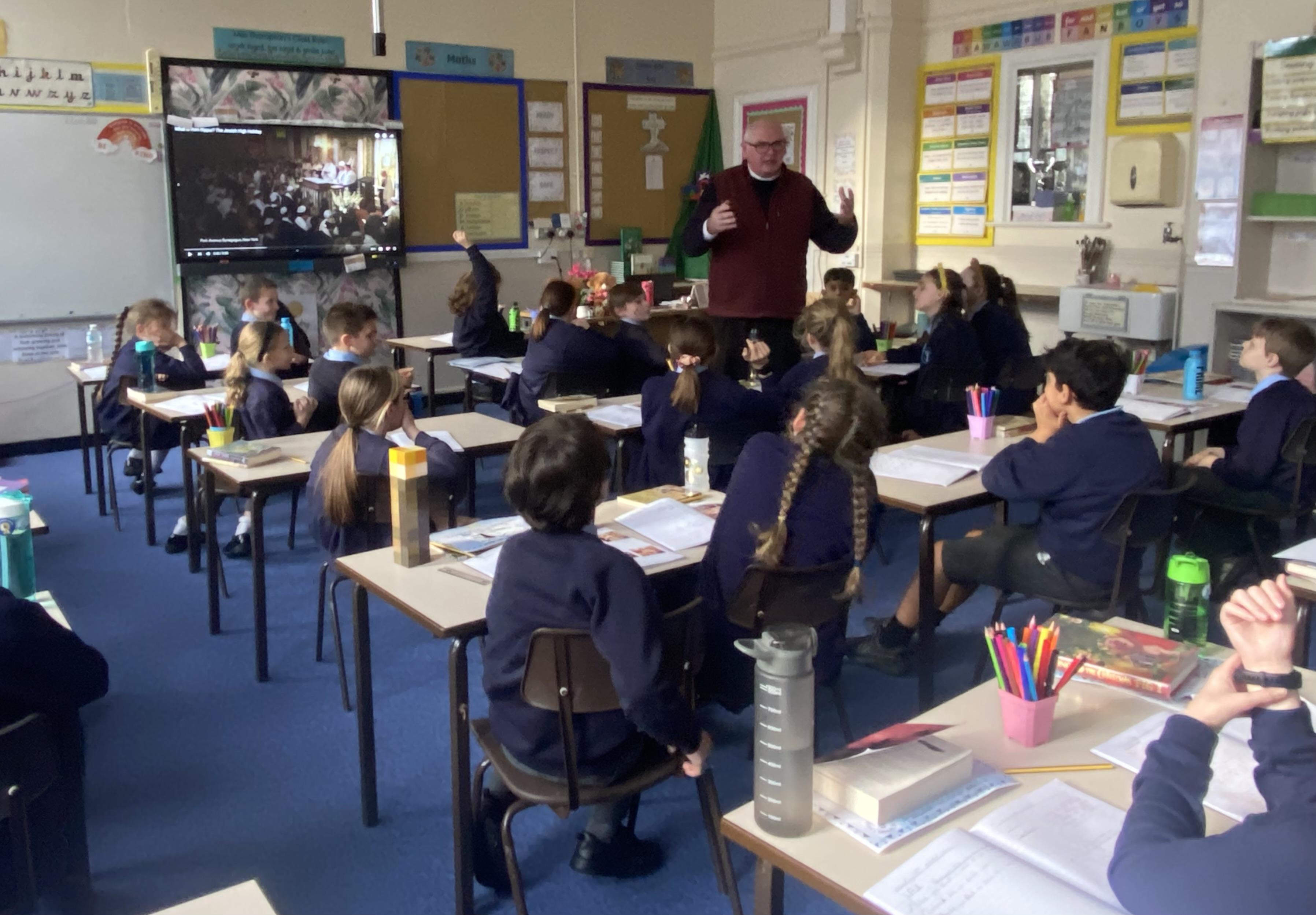 The children prepared questions to find out more about Fr Martin's vocation.